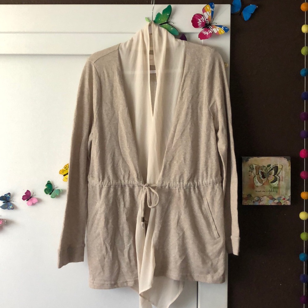 Skies are blue cream/tan cardigan